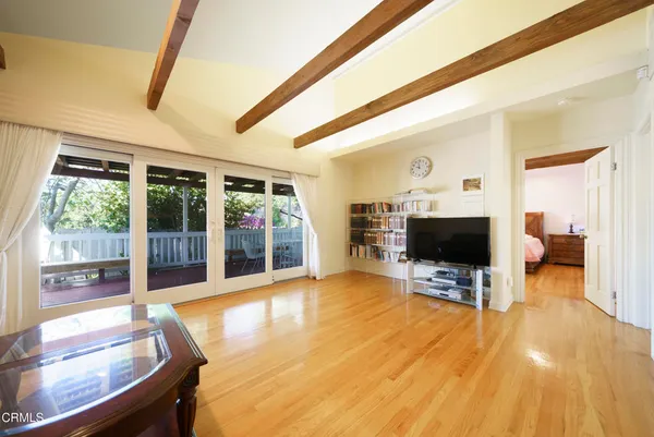 a living room with fireplace furniture and a flat screen tv