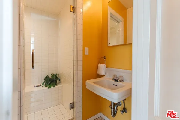 a bathroom with a sink and mirror