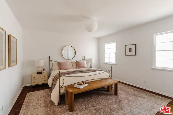 a bed room with a bed and a window