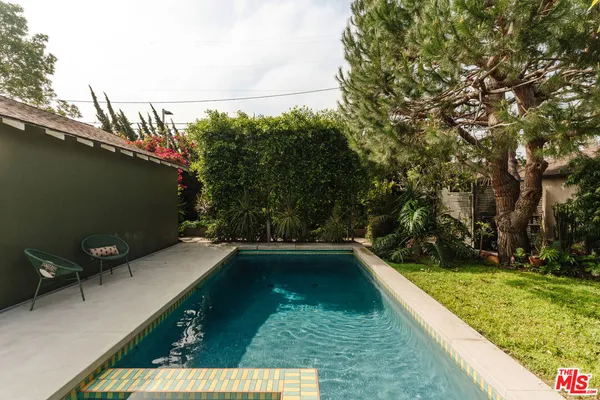 a view of swimming pool from a balcony