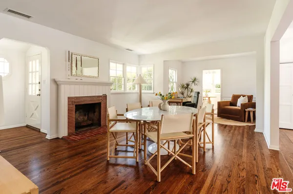 a view of a livingroom with furniture and a fireplace