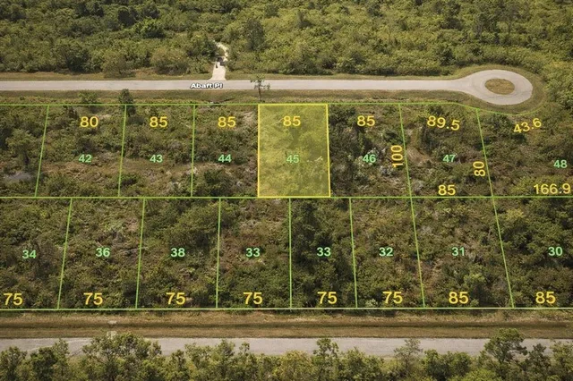 a bathroom with a bathtub and trees in the background