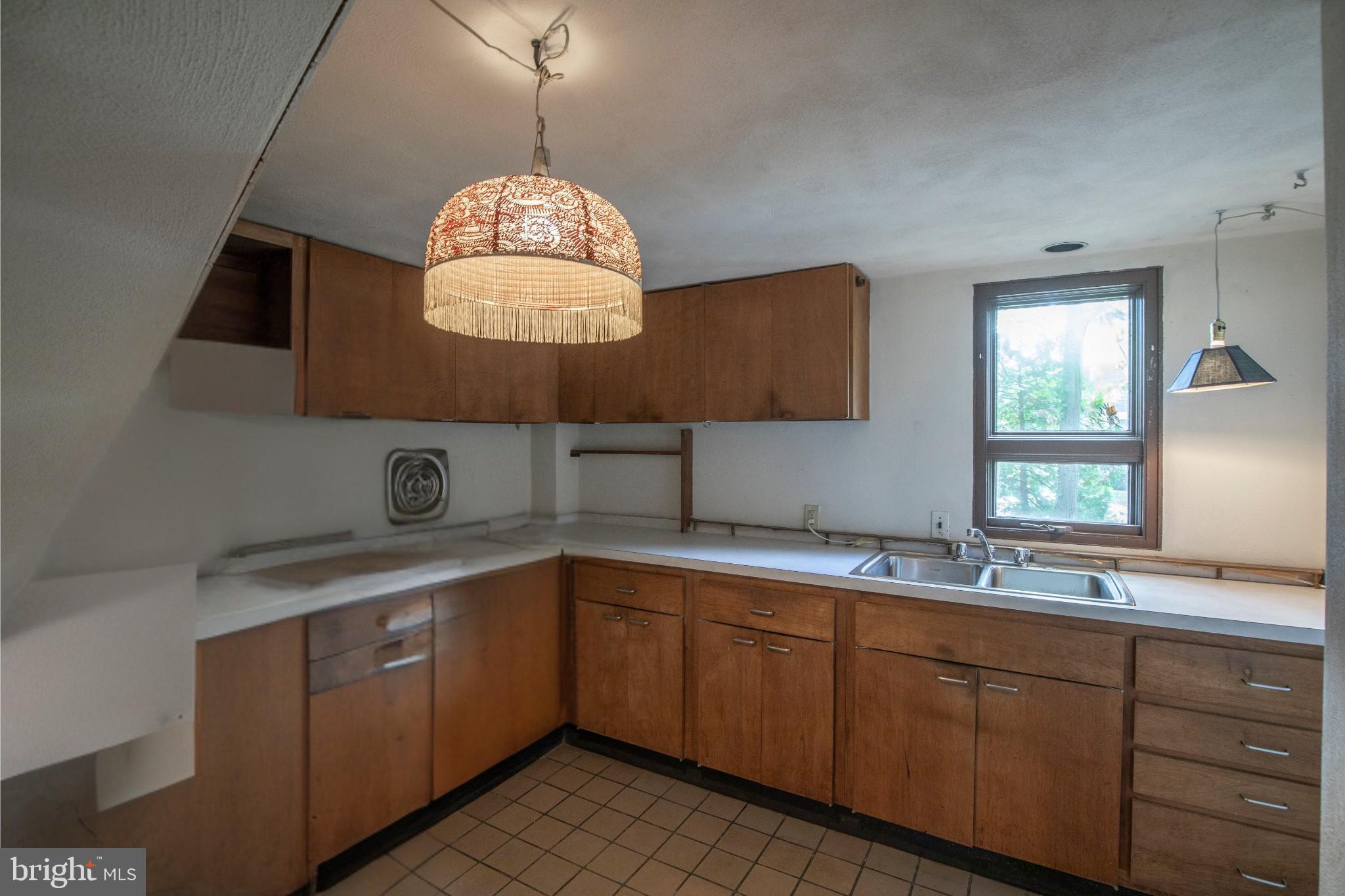 195 Lafayette Street Doylestown, PA 18901 - Photo 5 of 18 a kitchen with a sink cabinets and window