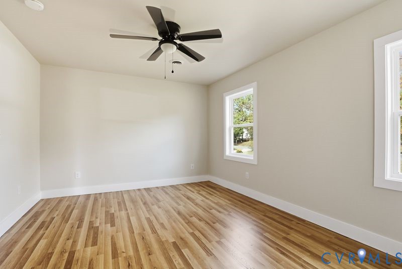 6010 Golden Wheel Road Providence Forge, VA 23140 - Photo 21 of 49 an empty room with a window and a ceiling fan