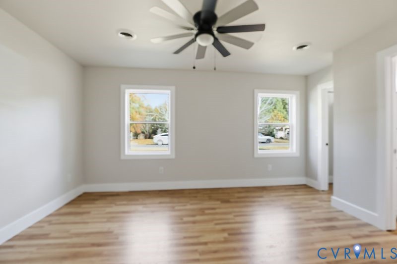 6010 Golden Wheel Road Providence Forge, VA 23140 - Photo 23 of 49 wooden floor in an empty room with a window