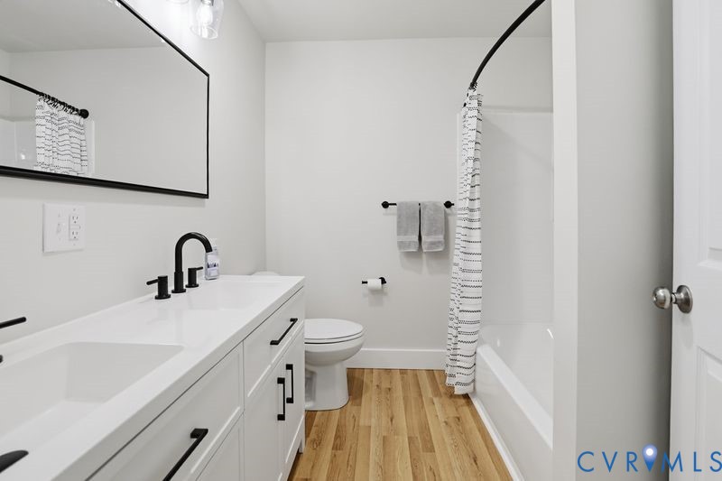 6010 Golden Wheel Road Providence Forge, VA 23140 - Photo 26 of 49 a bathroom with a sink a toilet and a mirror