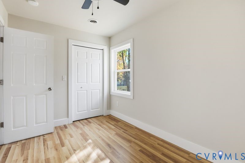 6010 Golden Wheel Road Providence Forge, VA 23140 - Photo 29 of 49 a view of an empty room with wooden floor