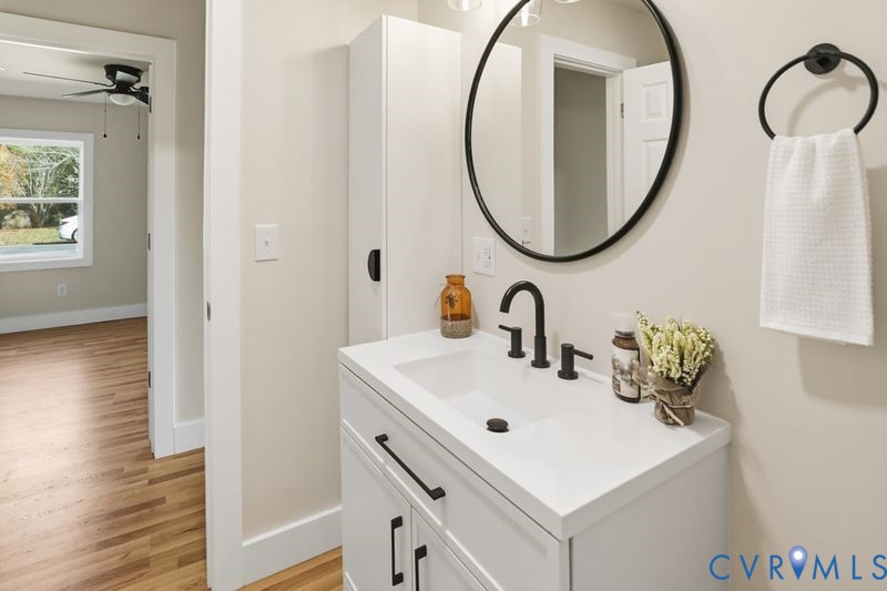 6010 Golden Wheel Road Providence Forge, VA 23140 - Photo 34 of 49 a bathroom with a sink and a mirror