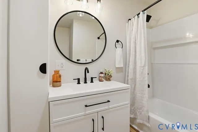 a bathroom with a sink a vanity and a mirror