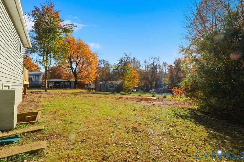 6010 Golden Wheel Road Providence Forge, VA 23140 - Photo 43 of 49 a view of a yard with trees