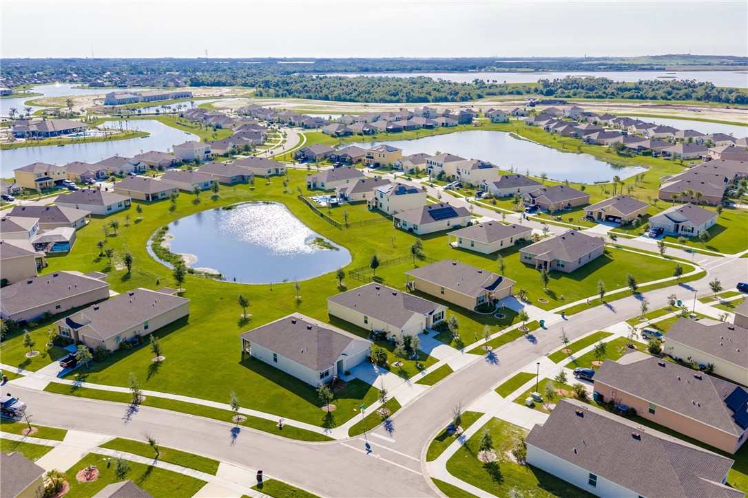 3453 Trinity Circle Fort Pierce, FL 34945 - Photo 3 of 36 an aerial view of residential houses with outdoor space