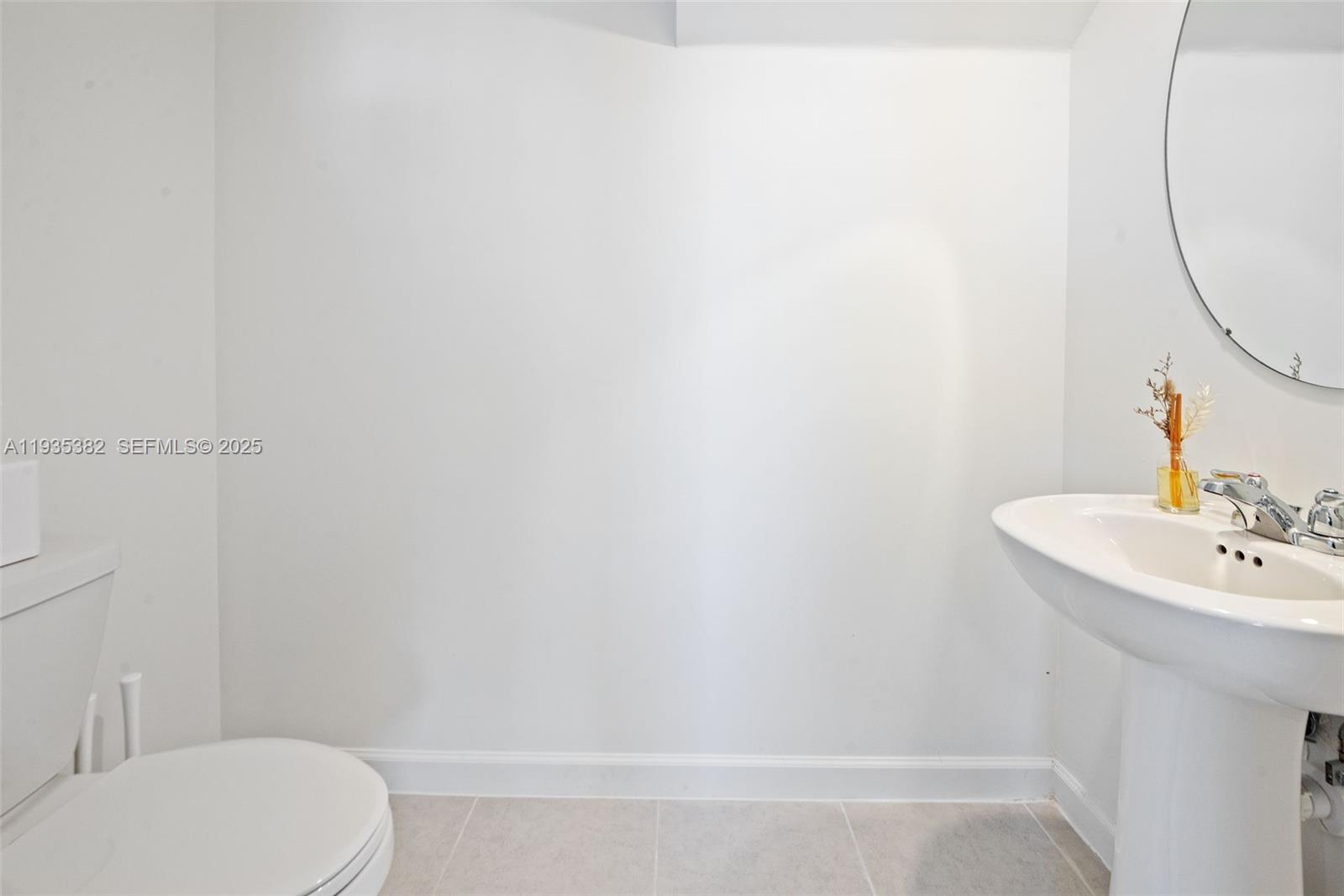 2400 Southeast 29th Street Homestead, FL 33035 - Photo 14 of 25 a bathroom with a sink and a mirror