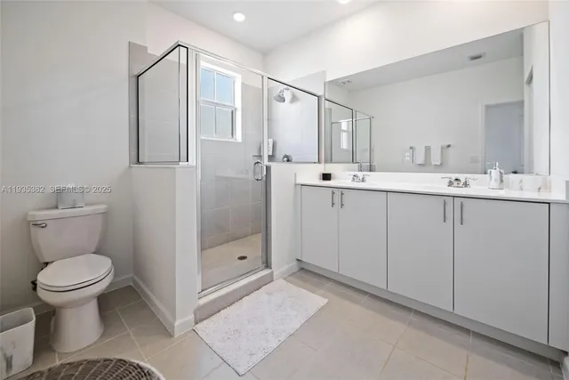 a bedroom with a bed and a lamp on table