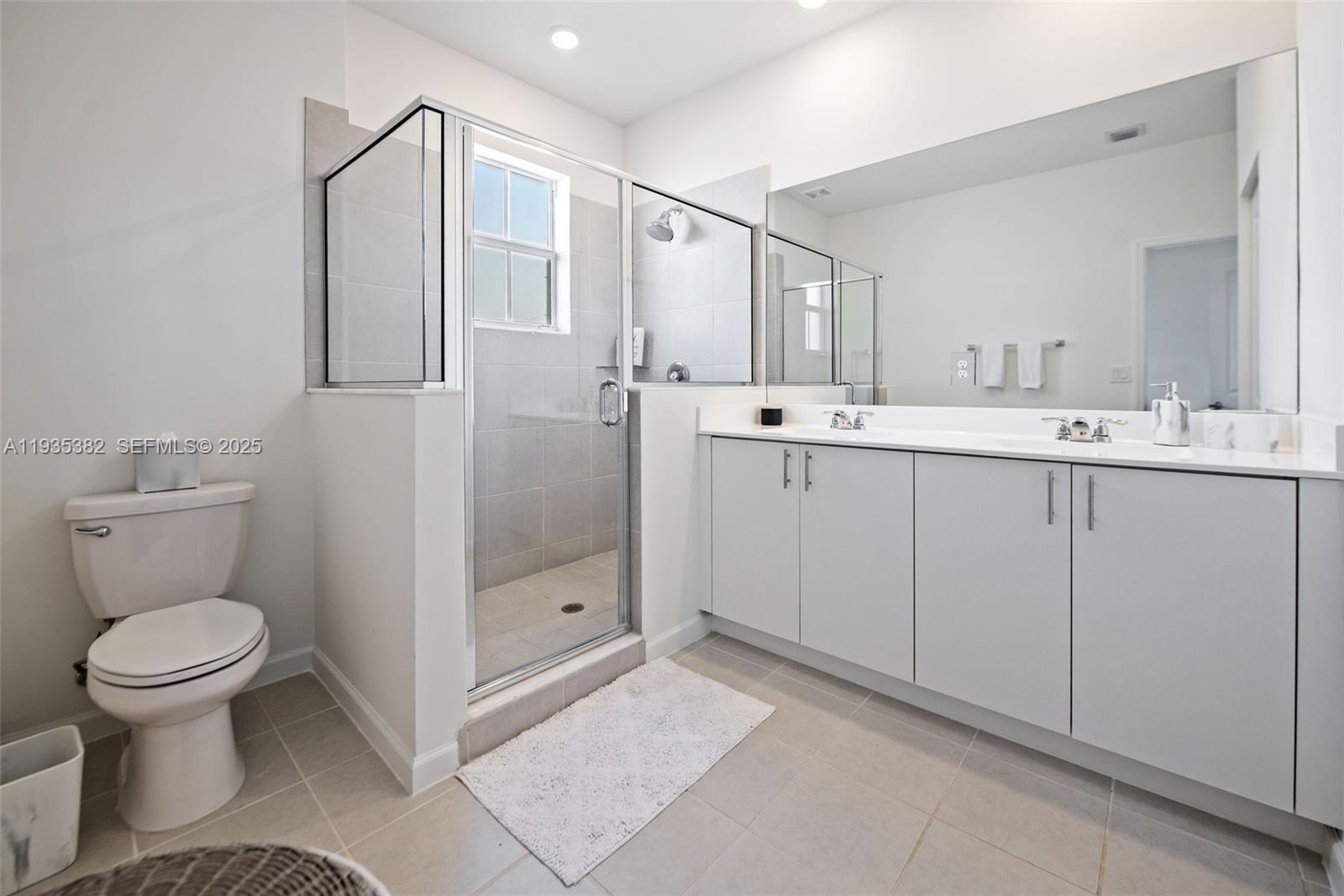 2400 Southeast 29th Street Homestead, FL 33035 - Photo 17 of 25 a bathroom with a toilet sink and mirror