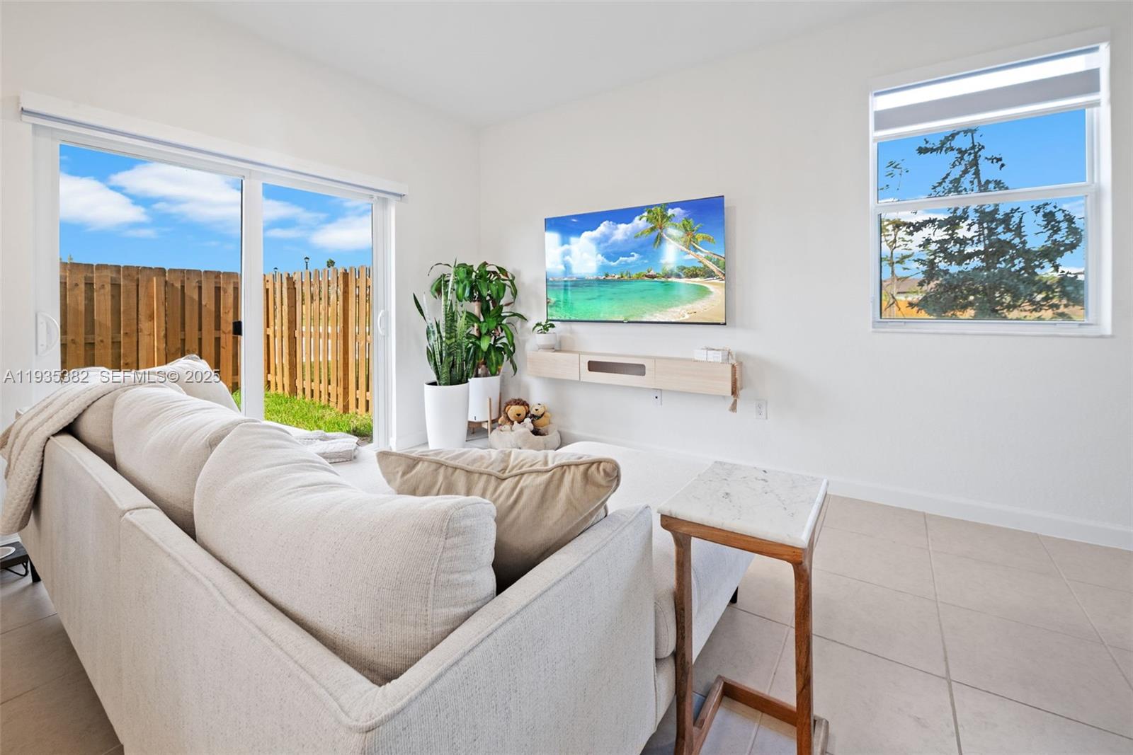 2400 Southeast 29th Street Homestead, FL 33035 - Photo 8 of 25 a living room with furniture and a large window
