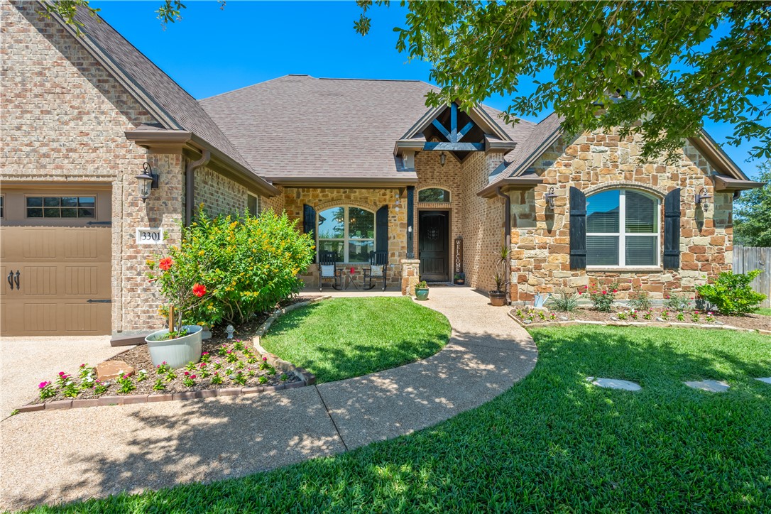 3301 Covington Court Bryan, TX 77808 - Photo 2 of 26 a front view of a house with garden