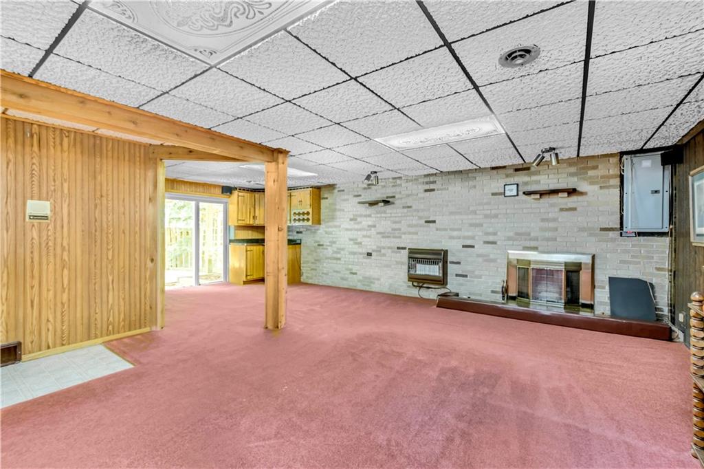 119 A Singleton Road Sarver, PA 16055 - Photo 17 of 22 Great space for a gameroom! Complete with a half bath and a gas fireplace.