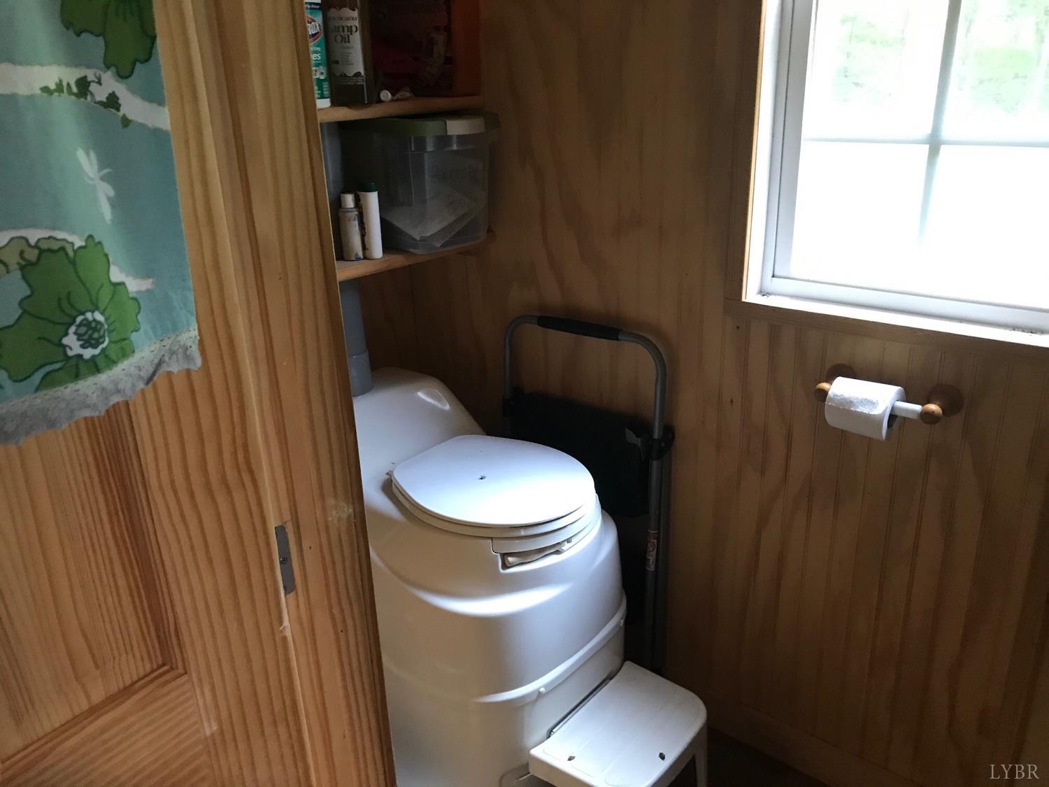 300 Scotts Branch Road Amherst, VA 24521 - Photo 12 of 16 a white toilet sitting next to a bathroom sink