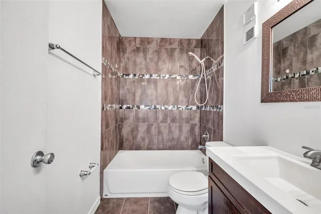 a bathroom with a sink a toilet and a bathtub