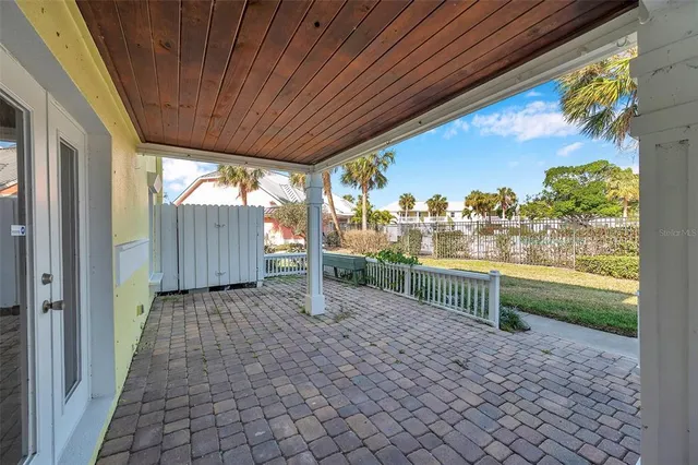 a view of a house with wooden fence