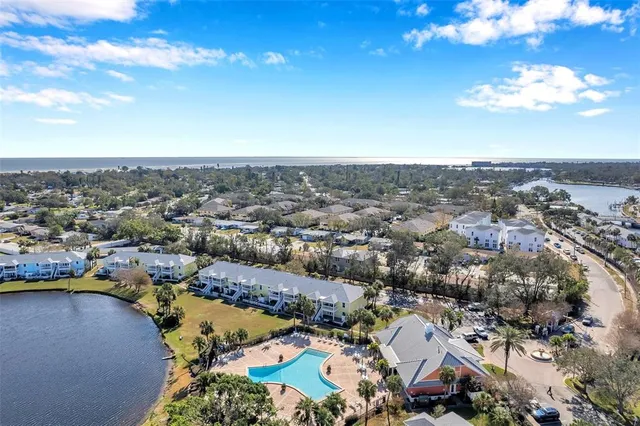 a large white kitchen with a table and chairs