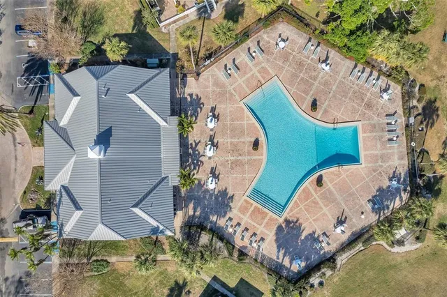 a view of swimming pool with a lake and mountain view