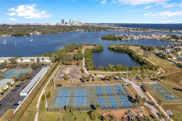 a view of a livingroom with furniture and a book shelf