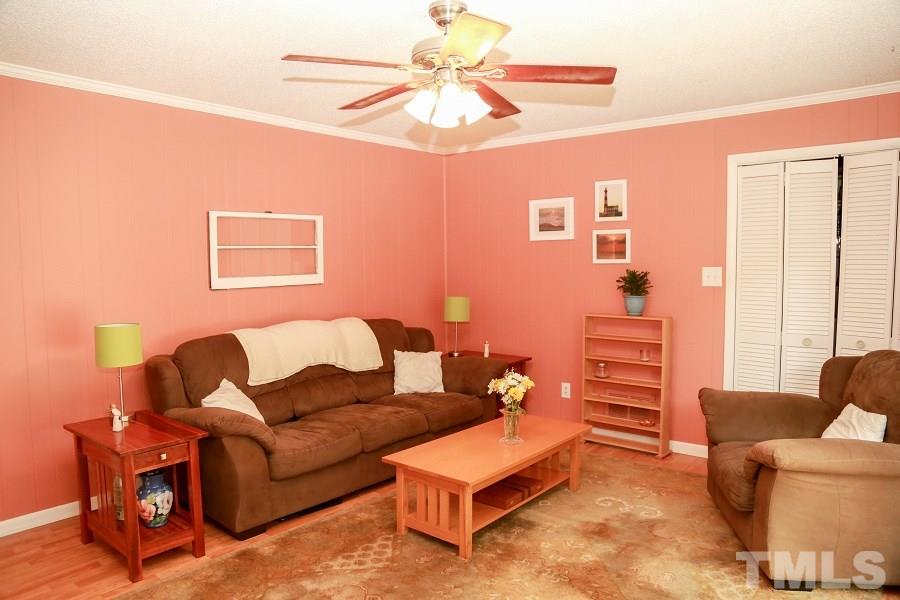 1501 Kelly Road Garner, NC 27529 - Photo 13 of 25 a living room with furniture and a window