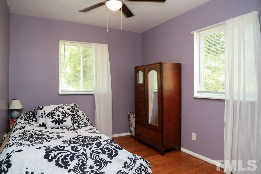 1501 Kelly Road Garner, NC 27529 - Photo 18 of 25 a bedroom with a bed and a window