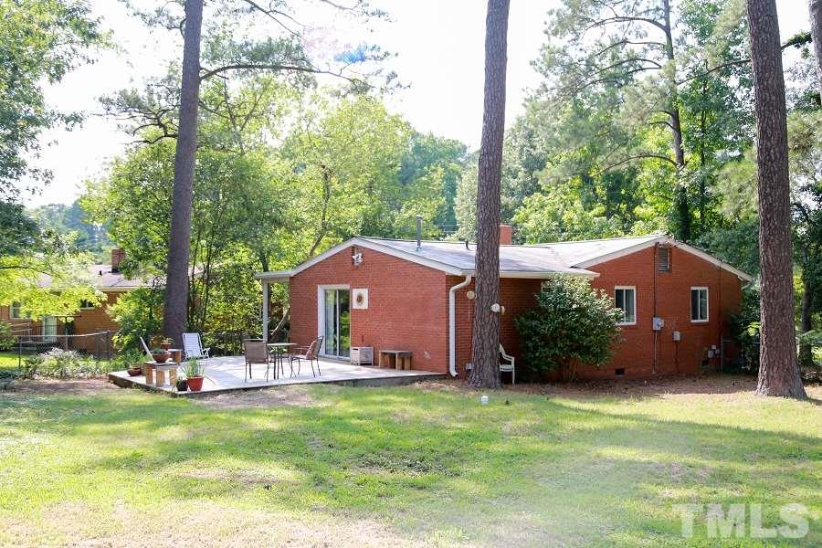 1501 Kelly Road Garner, NC 27529 - Photo 23 of 25 a front view of a house with garden