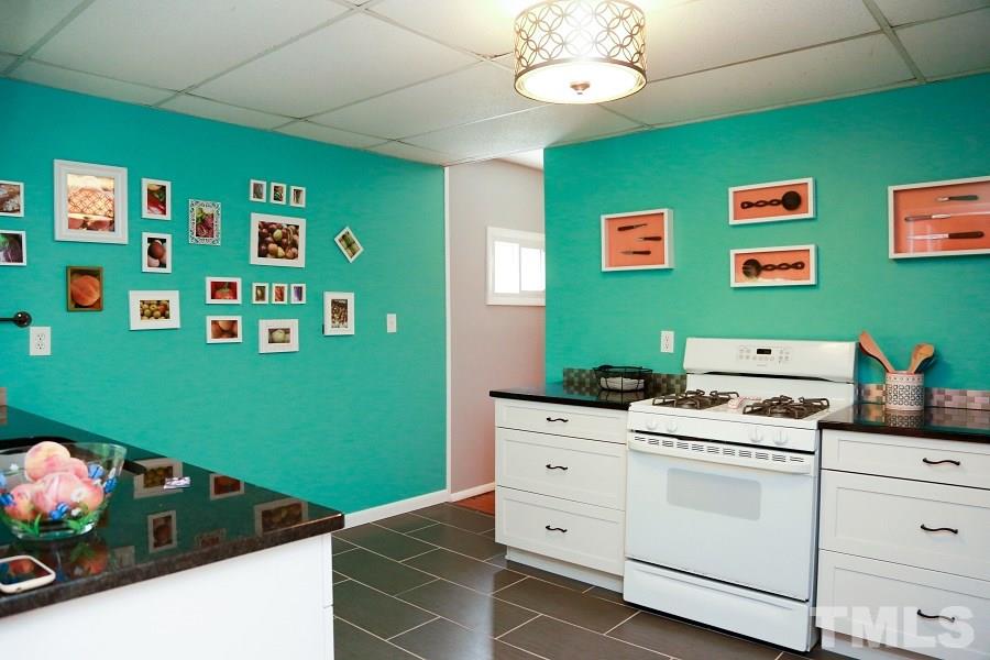 1501 Kelly Road Garner, NC 27529 - Photo 7 of 25 a utility room with fridge dryer and washer