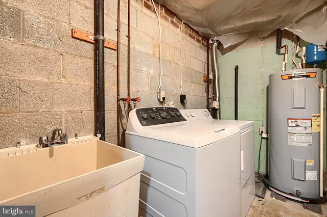 a utility room with dryer and washer