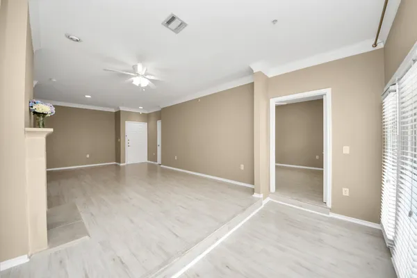 a view of a kitchen from a hallway