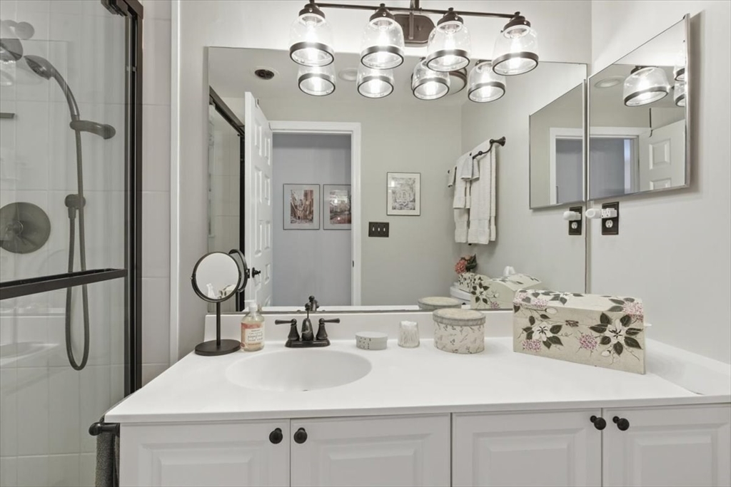 65 Glen Road, Unit H1 Brookline, MA 02445 - Photo 24 of 39 a bathroom with a sink vanity and mirror