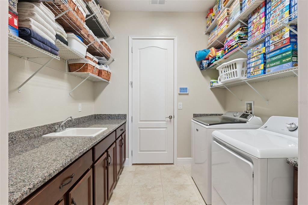 2665 Meadowedge Loop St. Cloud, FL 34772 - Photo 42 of 53 a utility room with dryer and washer