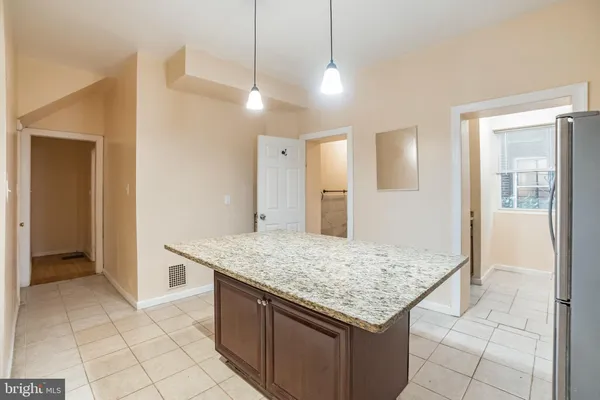 a kitchen with a counter top and a sink