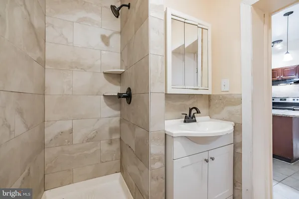 a bathroom with a sink a vanity and a mirror