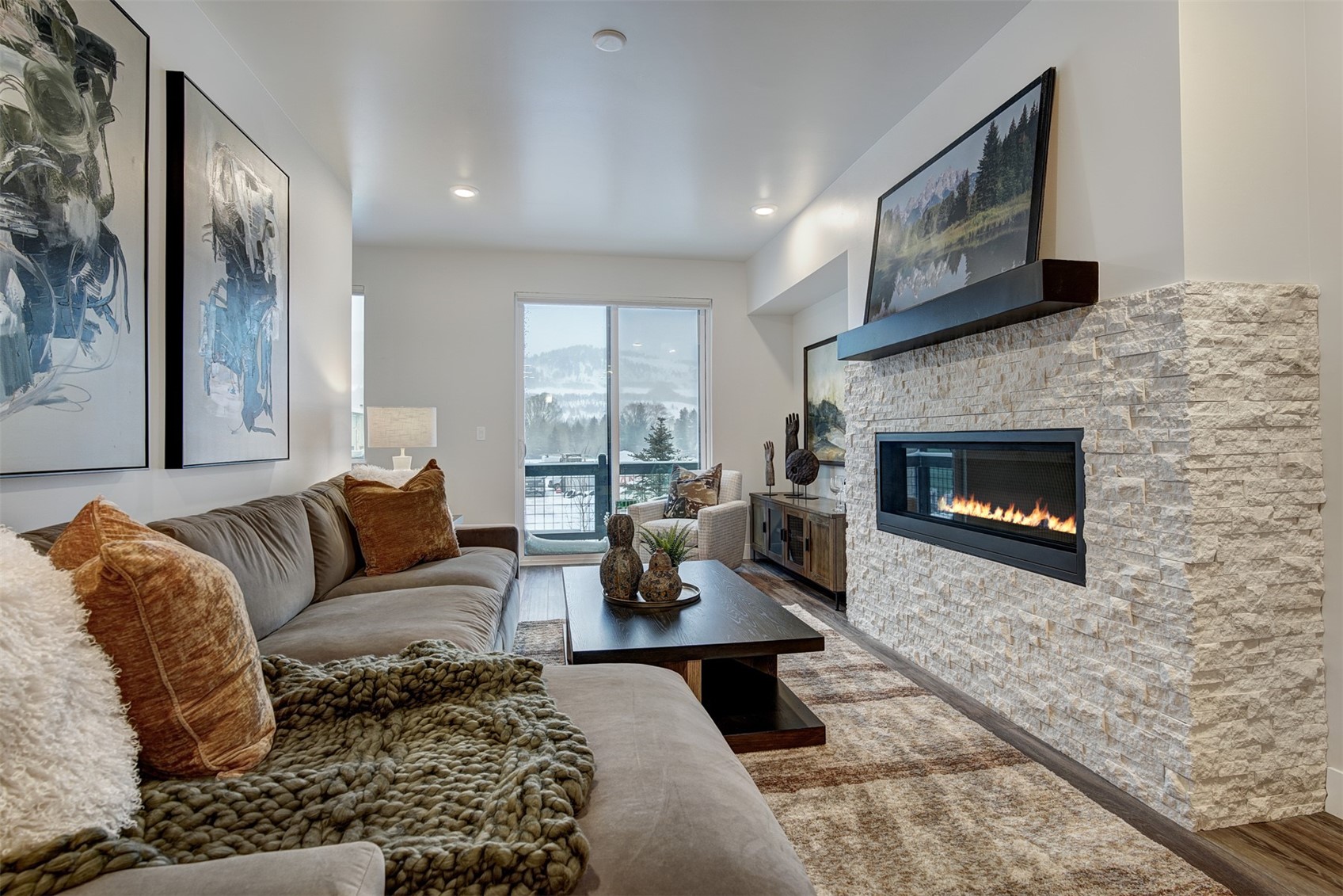 1301 Adams Avenue, Unit 128 Silverthorne, CO 80498 - Photo 6 of 27 a living room with furniture and a fireplace