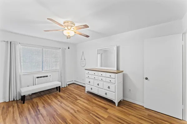 a view of a livingroom with wooden floor