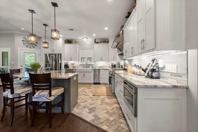 a bathroom with a sink mirror toilet and shower