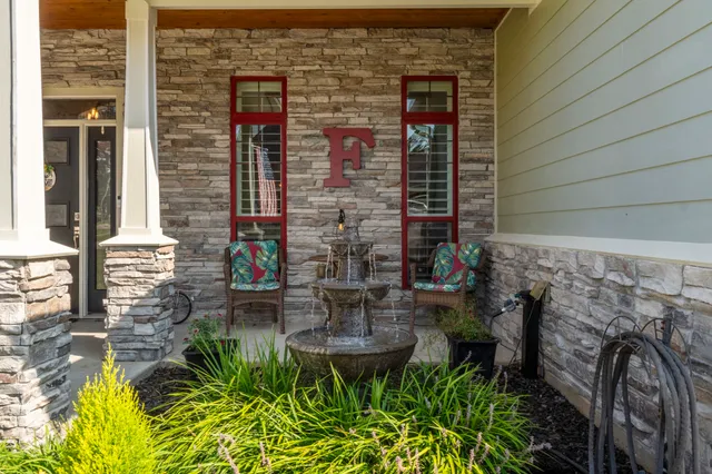 a kitchen with stainless steel appliances granite countertop a stove and white cabinets