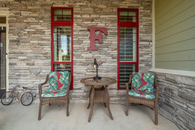 a bedroom with furniture and a flat screen tv