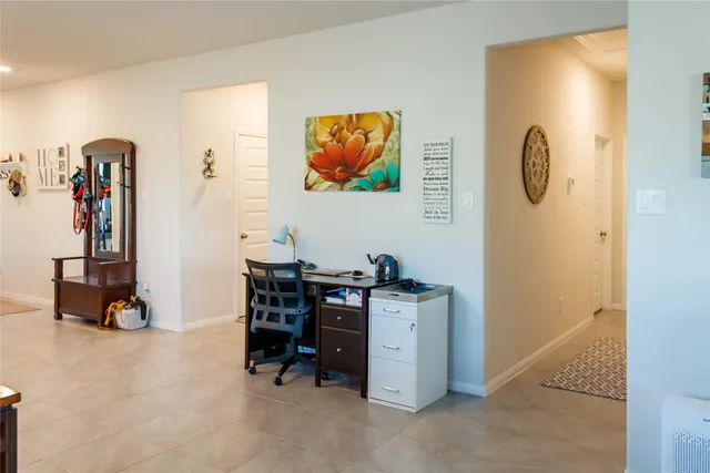 a view of a livingroom with furniture and closet