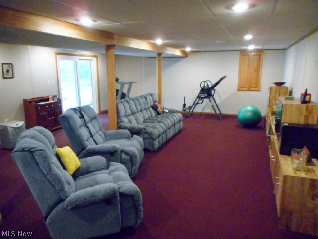 141 Lethbridge Circle Akron, OH 44321 - Photo 20 of 25 The basement has a newer rec room that walks out to paver patio and backyard.