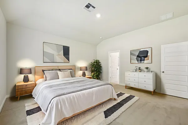 a bedroom with a bed and a view of bedroom