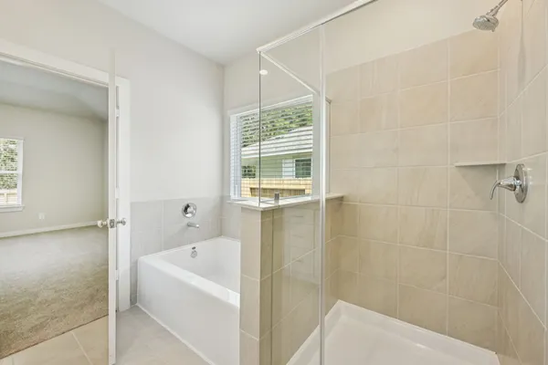 a white bath tub sitting next to a white sink