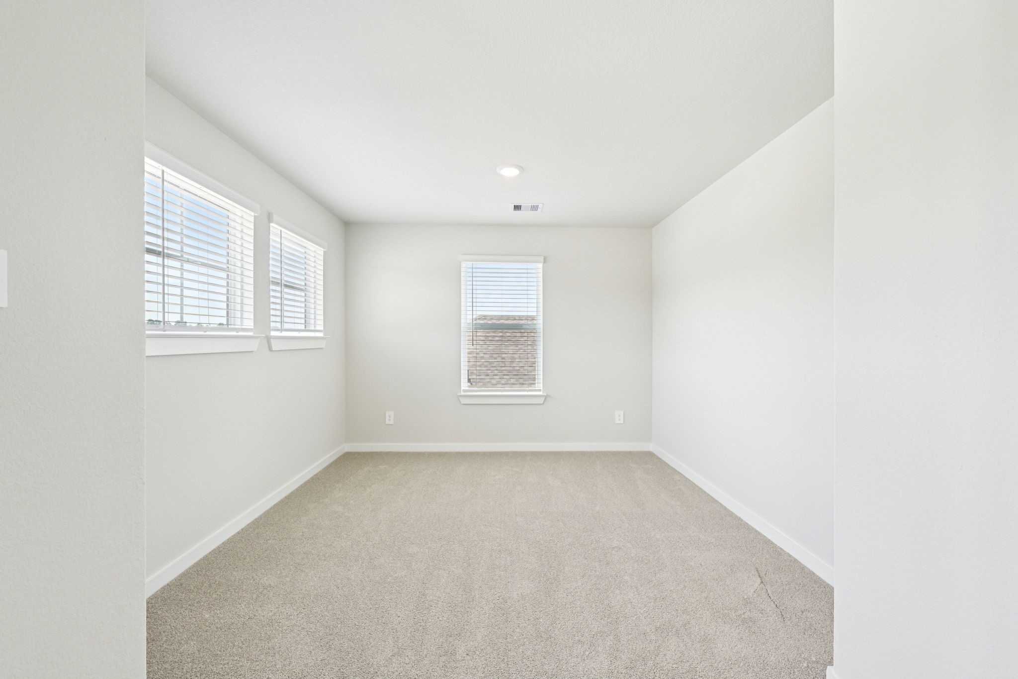 1653 Hopson Ranch Drive Conroe, TX 77301 - Photo 25 of 38 an empty room with windows