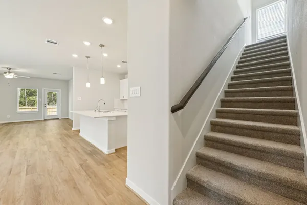 a view of an entryway with wooden floor