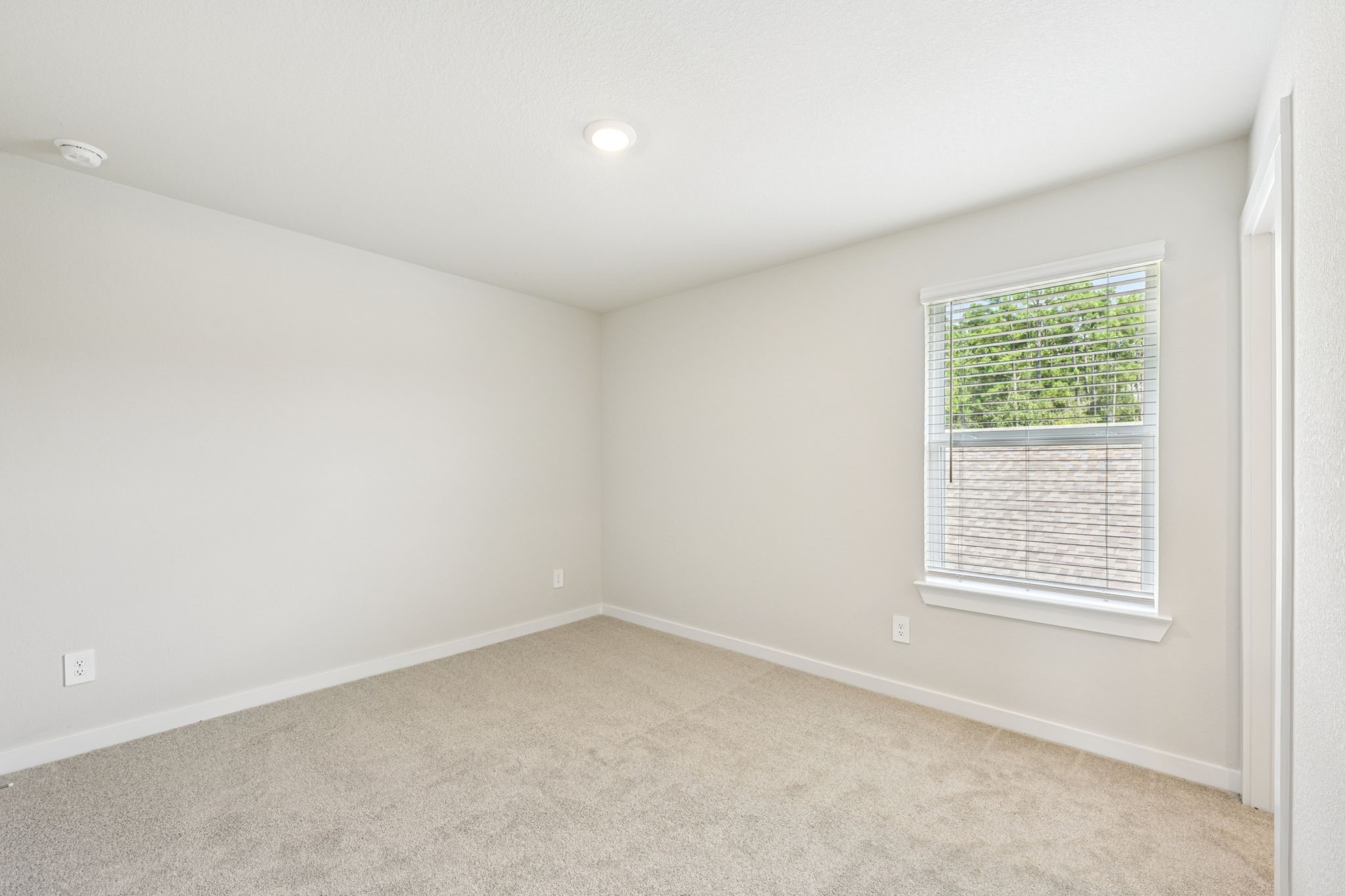1653 Hopson Ranch Drive Conroe, TX 77301 - Photo 29 of 38 an empty room with a window