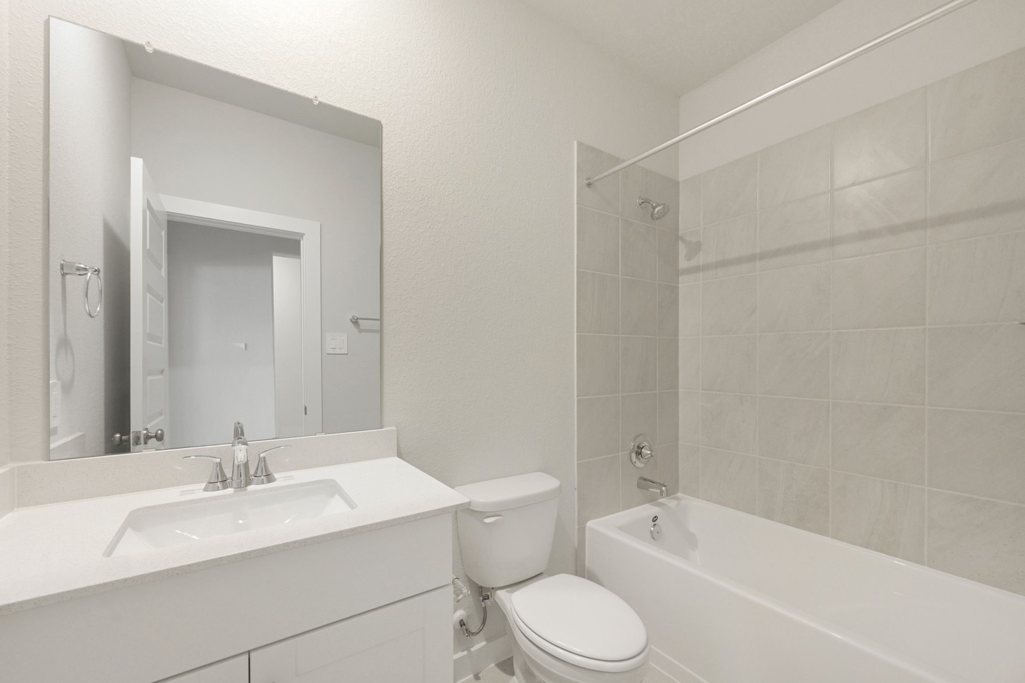 1653 Hopson Ranch Drive Conroe, TX 77301 - Photo 31 of 38 a bathroom with a bathtub shower sink vanity mirror and toilet